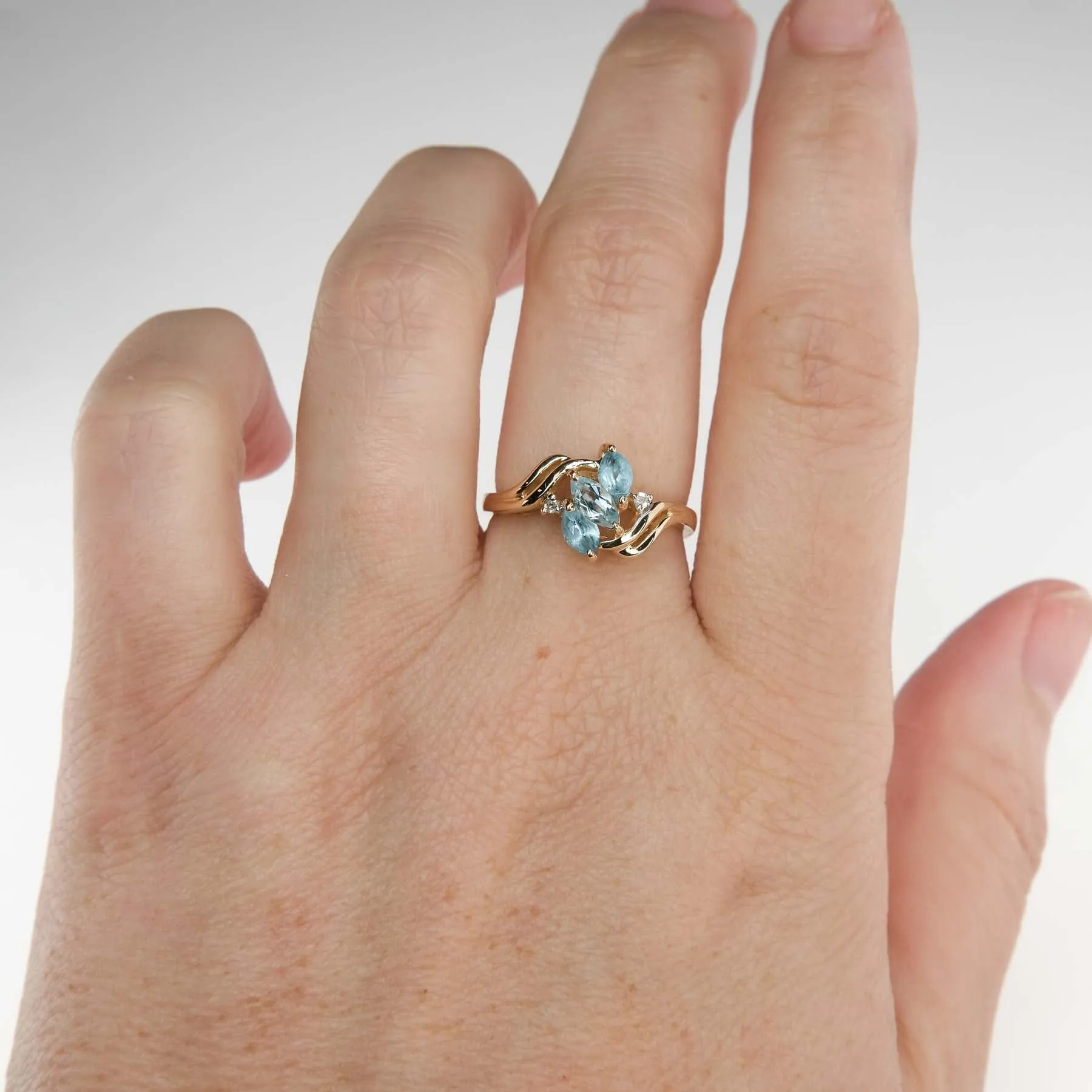 0.57ctw Blue Topaz with Diamond Accents Gemstone Ring in 14K Yellow Gold