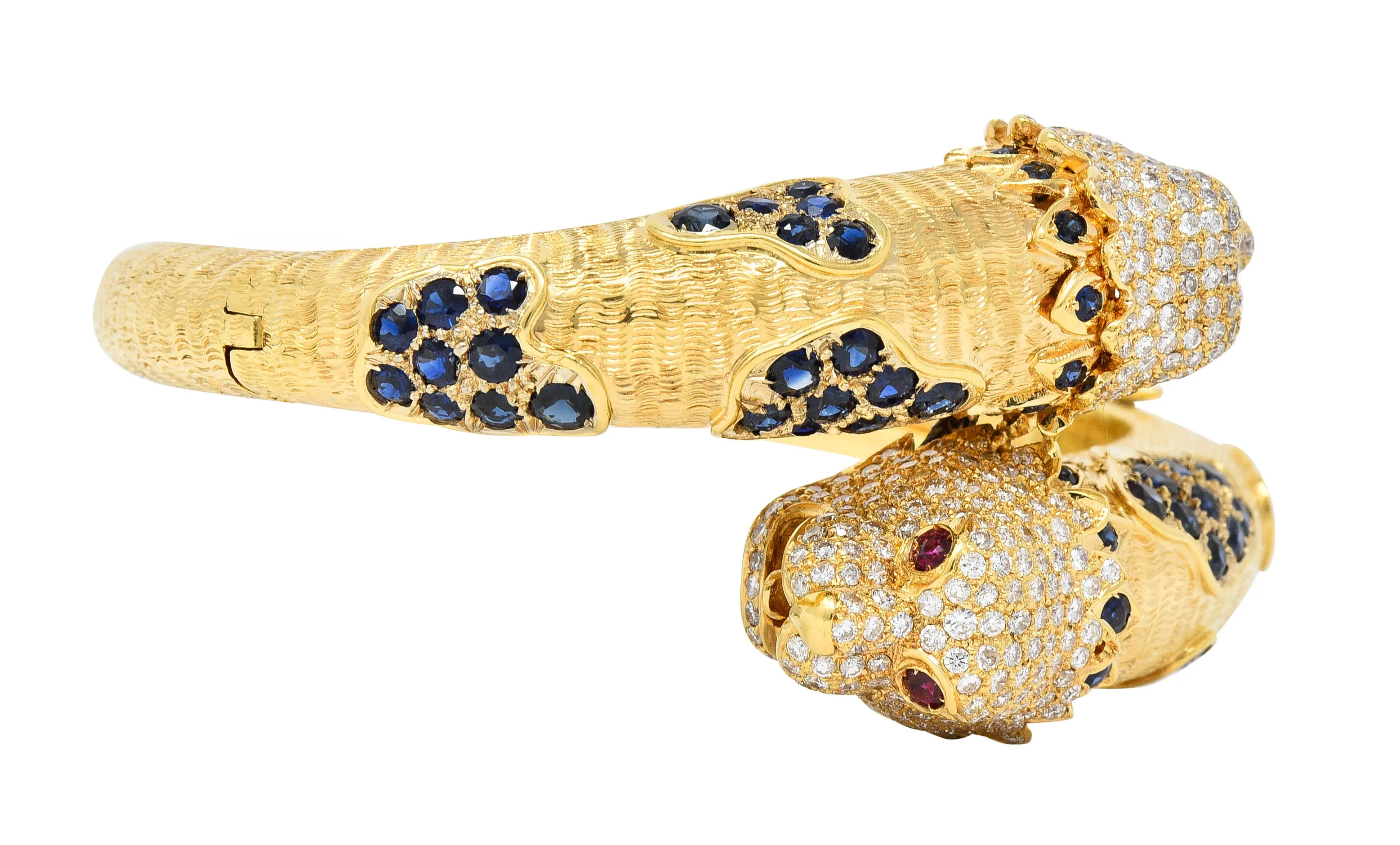 1970's 9.48 CTW Sapphire Ruby Diamond 18 Karat Yellow Gold Lion-Head Vintage Bypass Bangle Bracelet
