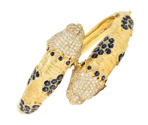 1970's 9.48 CTW Sapphire Ruby Diamond 18 Karat Yellow Gold Lion-Head Vintage Bypass Bangle Bracelet