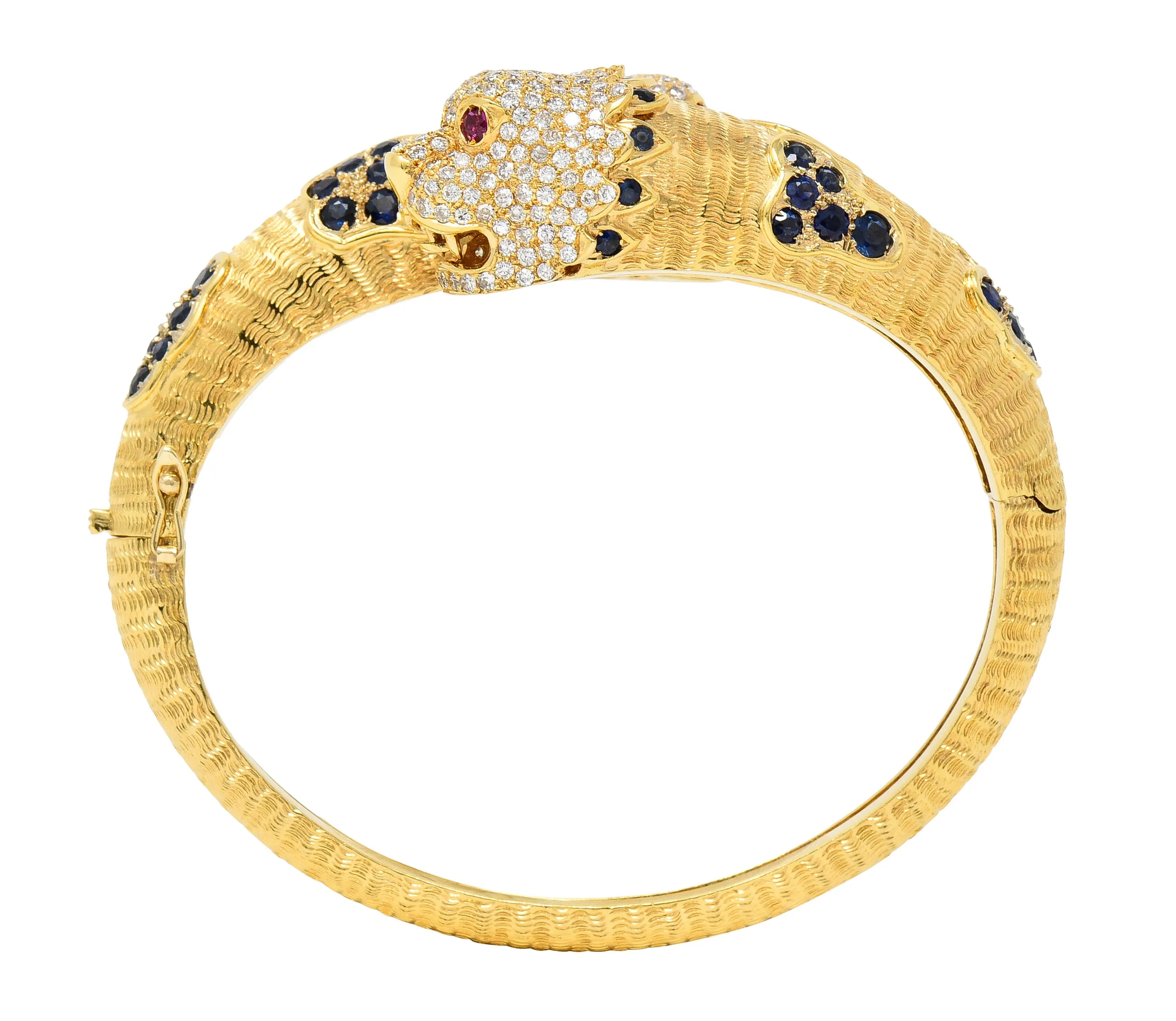 1970's 9.48 CTW Sapphire Ruby Diamond 18 Karat Yellow Gold Lion-Head Vintage Bypass Bangle Bracelet