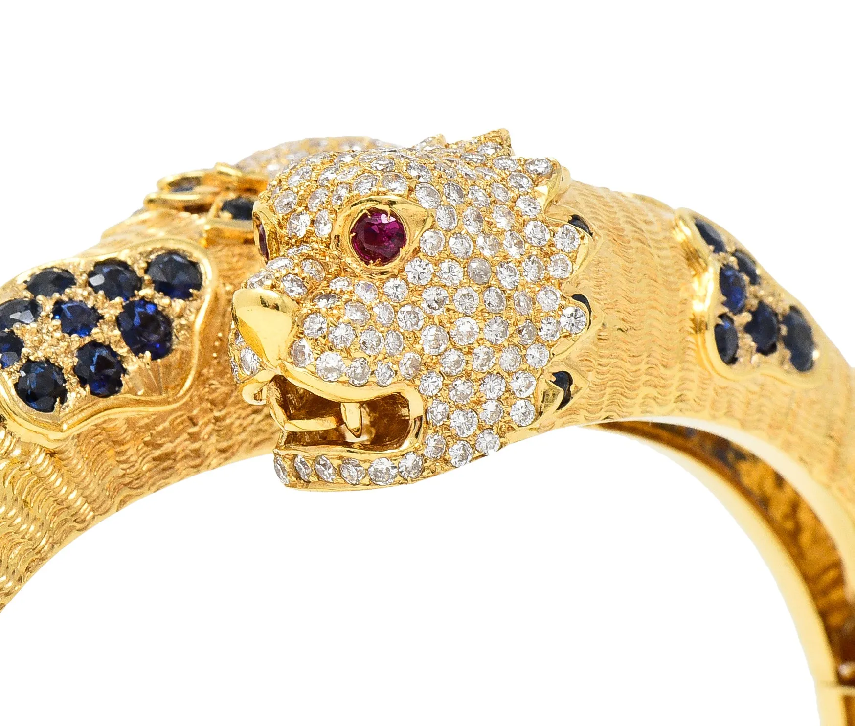 1970's 9.48 CTW Sapphire Ruby Diamond 18 Karat Yellow Gold Lion-Head Vintage Bypass Bangle Bracelet