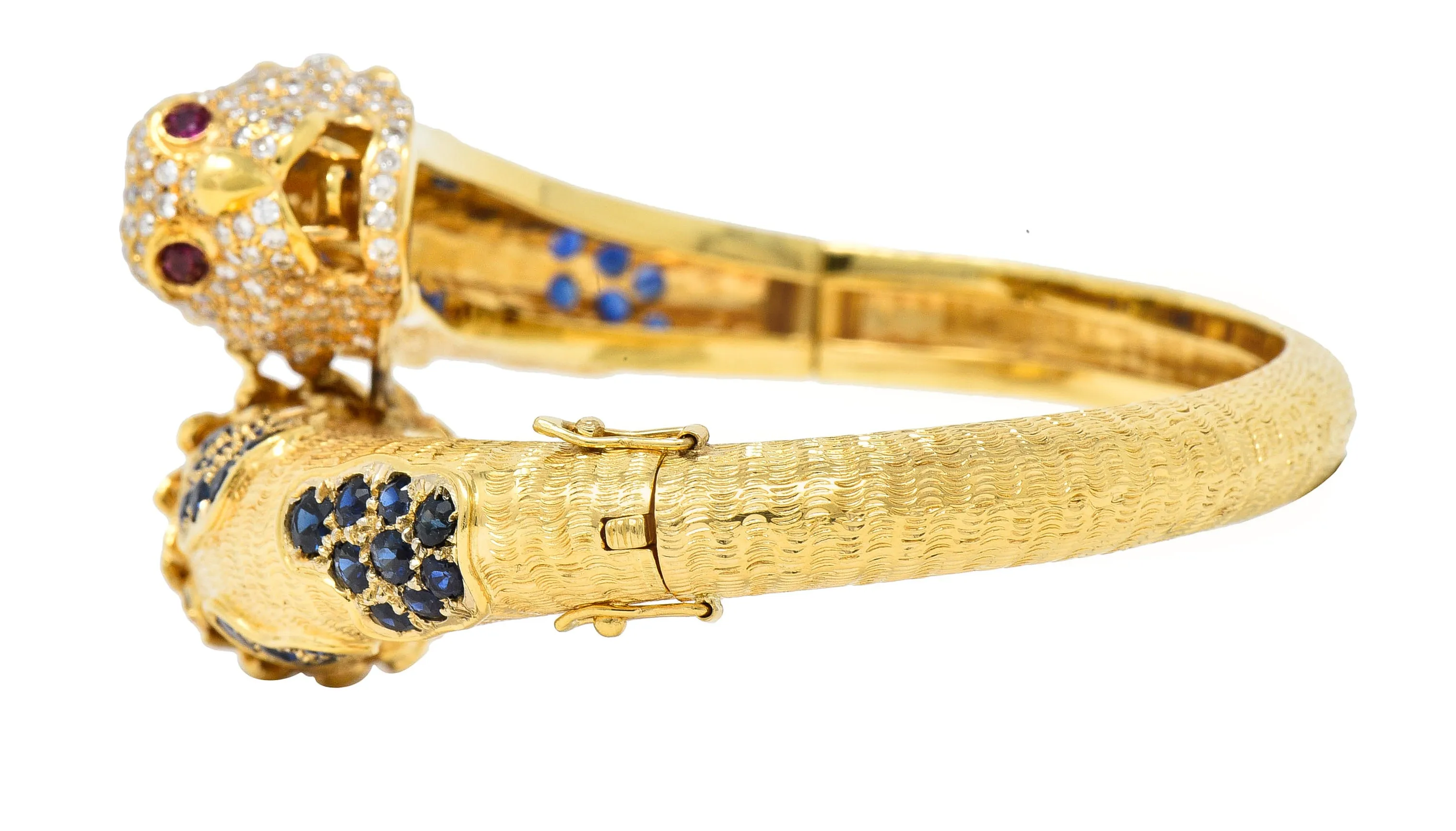 1970's 9.48 CTW Sapphire Ruby Diamond 18 Karat Yellow Gold Lion-Head Vintage Bypass Bangle Bracelet