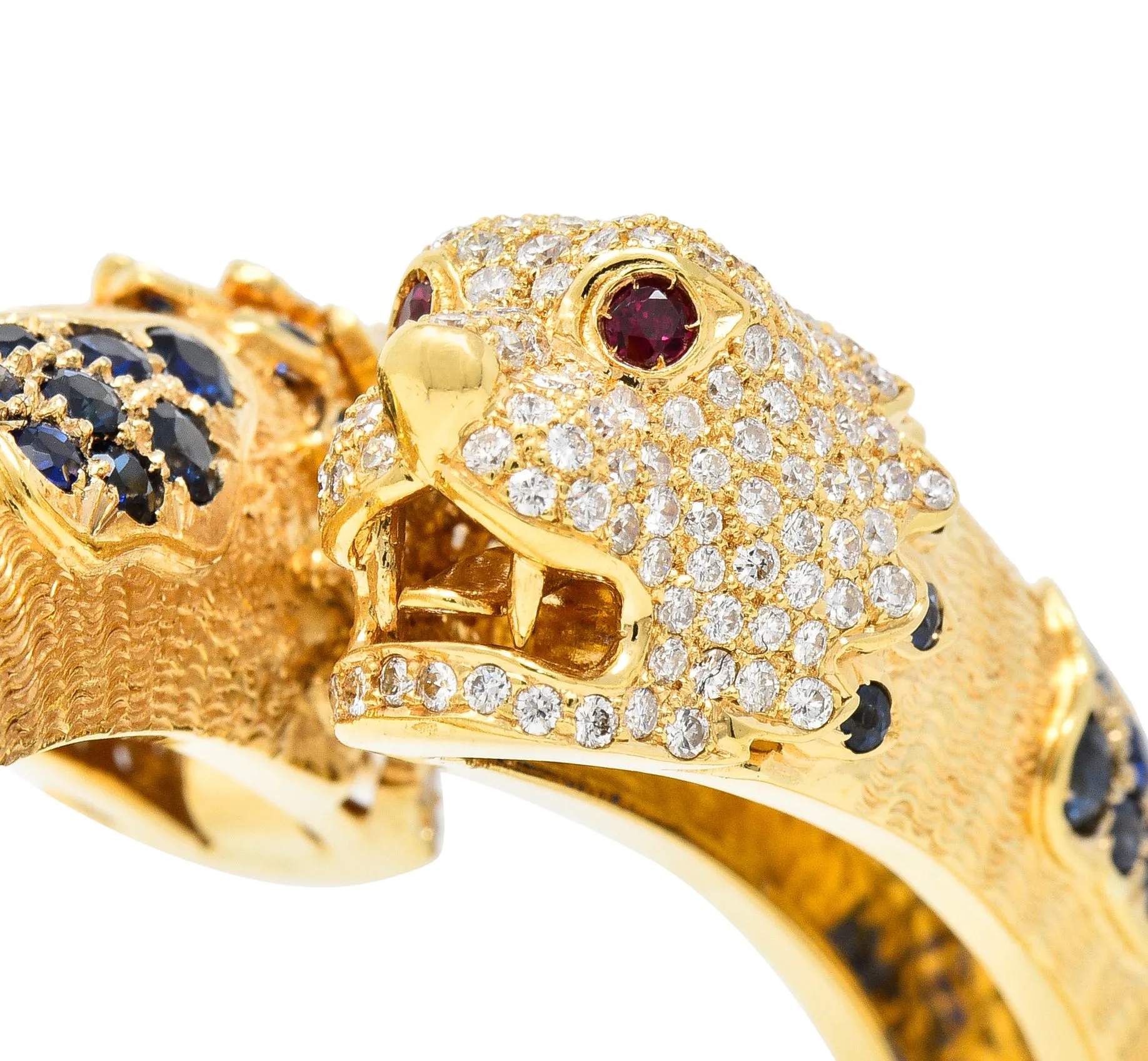 1970's 9.48 CTW Sapphire Ruby Diamond 18 Karat Yellow Gold Lion-Head Vintage Bypass Bangle Bracelet