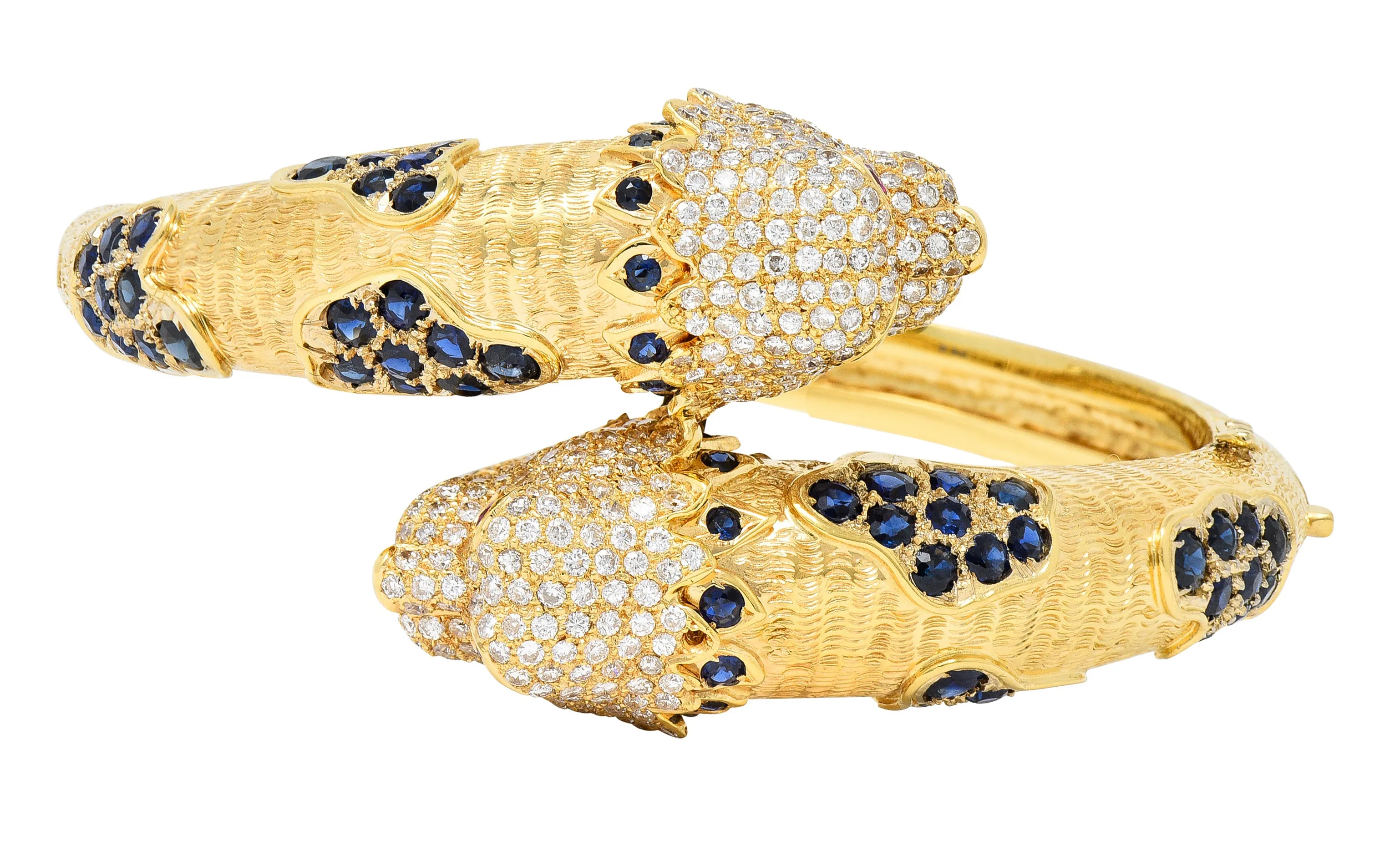 1970's 9.48 CTW Sapphire Ruby Diamond 18 Karat Yellow Gold Lion-Head Vintage Bypass Bangle Bracelet